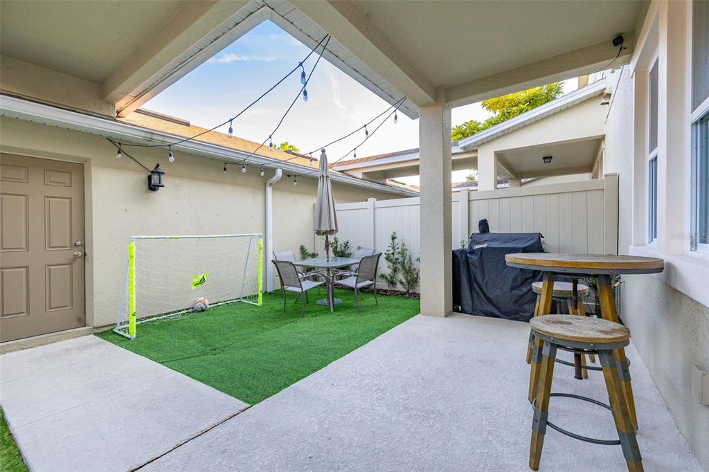 12333 Via Derna Place Windermere, FL 34786 - Photo 41 of 56 a backyard of a house with table and chairs