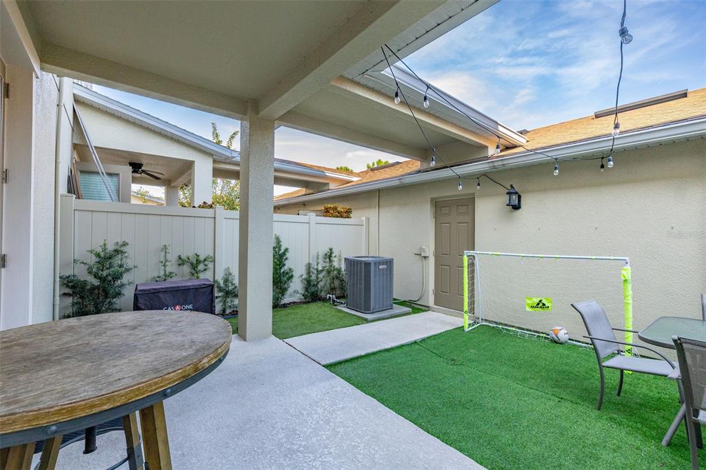 12333 Via Derna Place Windermere, FL 34786 - Photo 42 of 56 a view of an house with backyard space and garden