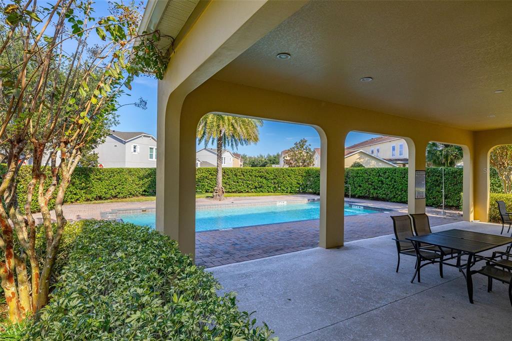 12333 Via Derna Place Windermere, FL 34786 - Photo 55 of 56 a view of a porch with chairs and backyard