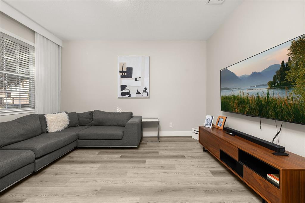 12333 Via Derna Place Windermere, FL 34786 - Photo 6 of 56 a living room with furniture and a flat screen tv