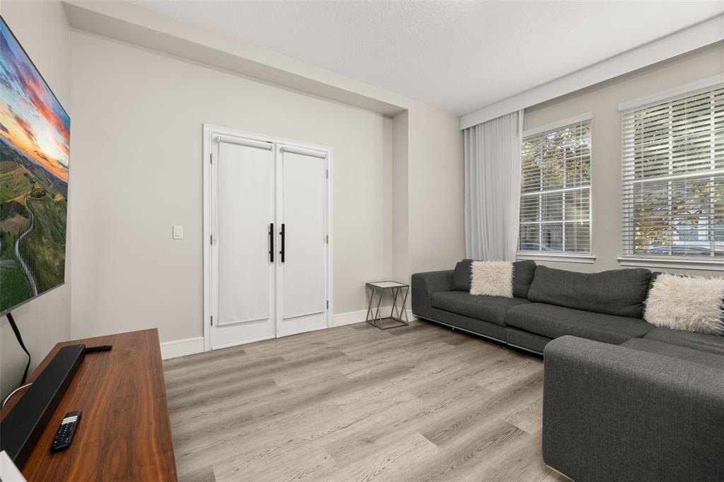 12333 Via Derna Place Windermere, FL 34786 - Photo 8 of 56 a living room with furniture and a flat screen tv