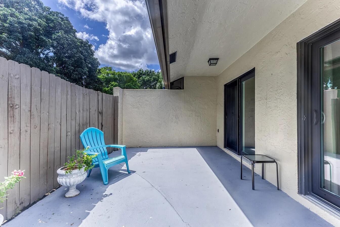 23284 Southwest 53rd Avenue, Unit D Boca Raton, FL 33433 - Photo 14 of 22 a view of a chairs in patio