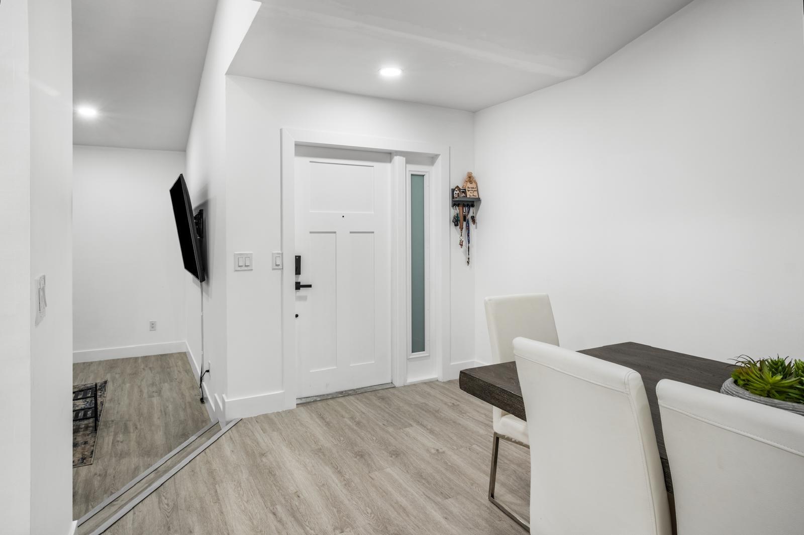 23284 Southwest 53rd Avenue, Unit D Boca Raton, FL 33433 - Photo 16 of 22 a view of a livingroom with wooden floor and bathroom
