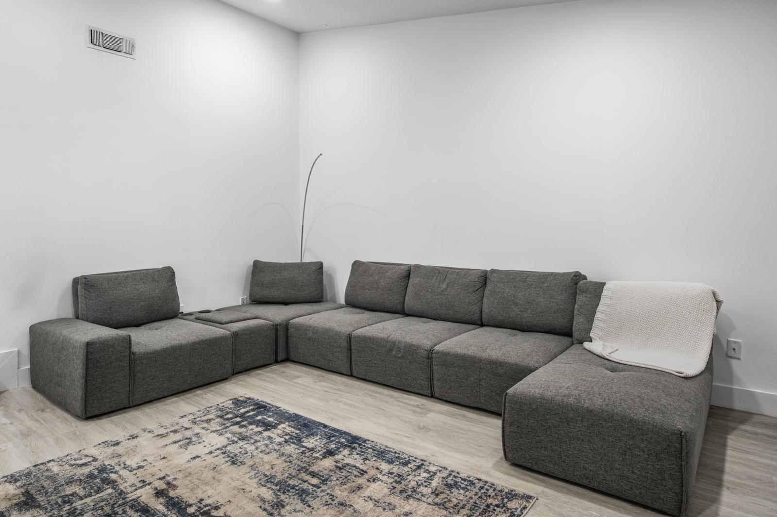 23284 Southwest 53rd Avenue, Unit D Boca Raton, FL 33433 - Photo 17 of 22 a living room with furniture and a couch