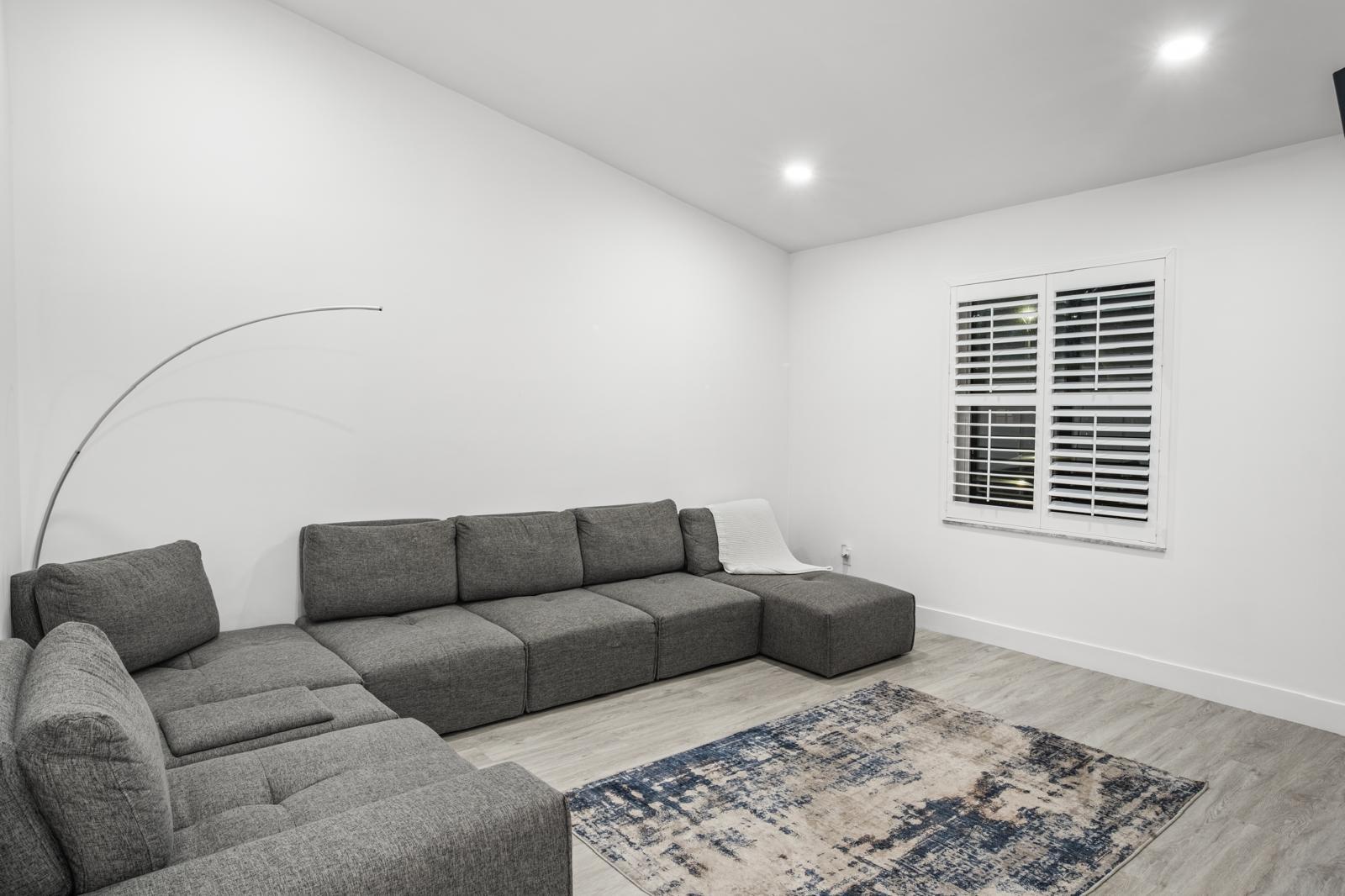 23284 Southwest 53rd Avenue, Unit D Boca Raton, FL 33433 - Photo 18 of 22 a living room with furniture and a window