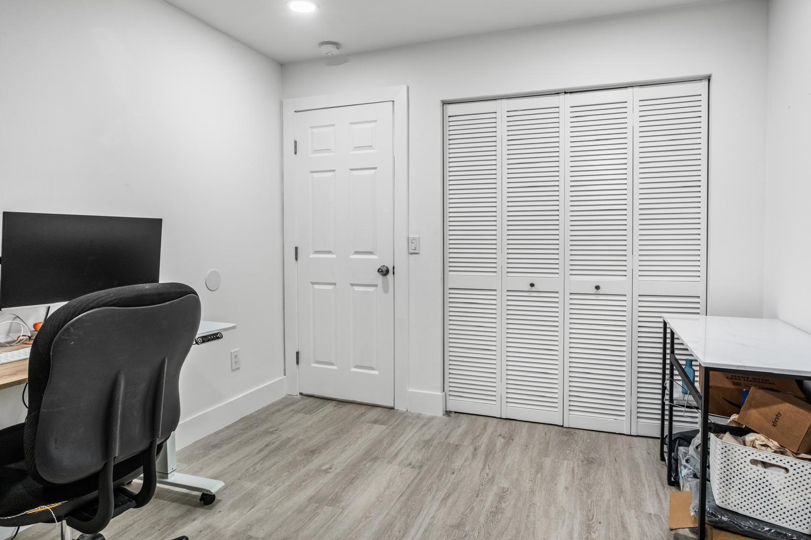 23284 Southwest 53rd Avenue, Unit D Boca Raton, FL 33433 - Photo 19 of 22 a view of a workspace with furniture and a window