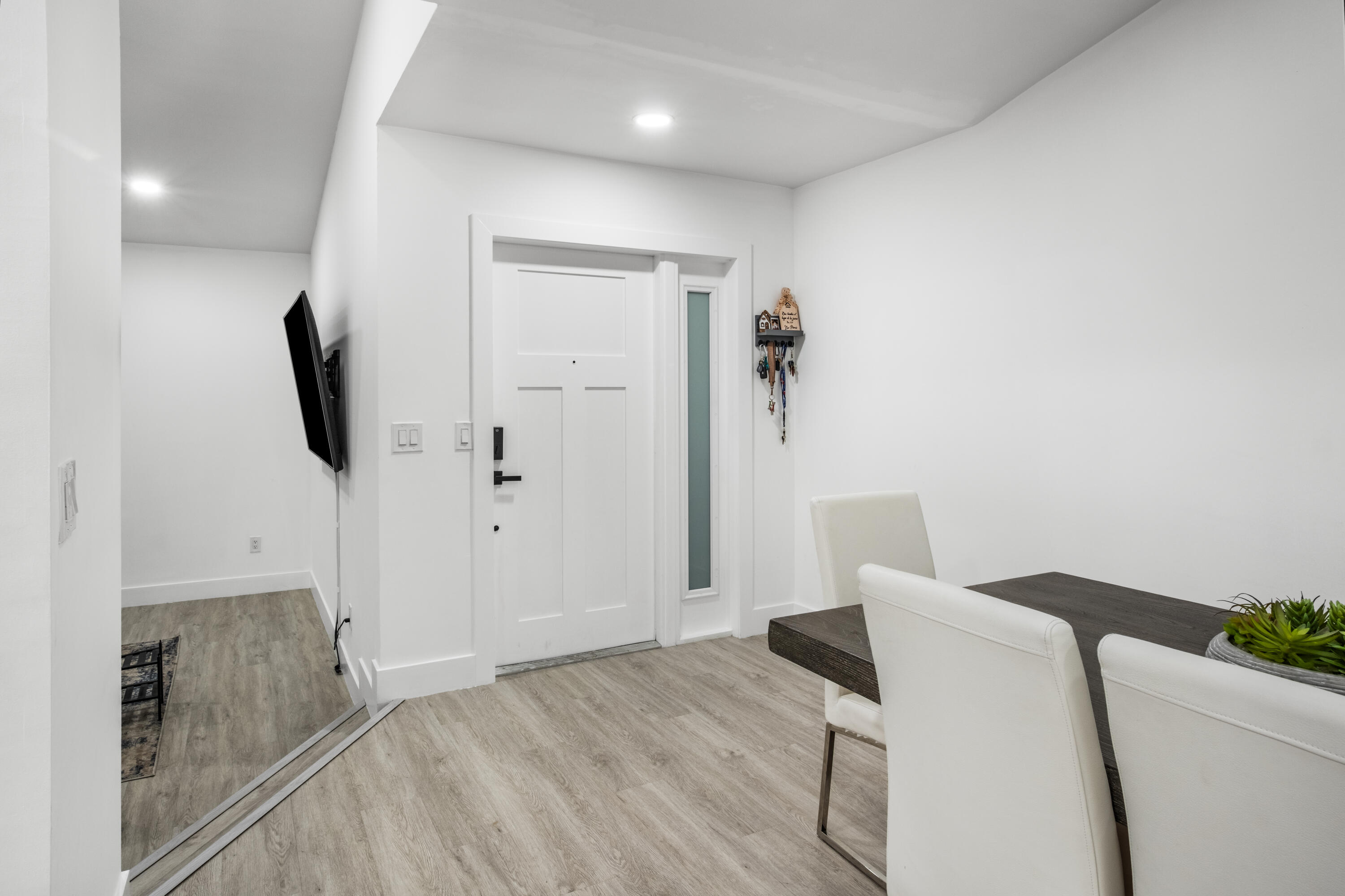 23284 Southwest 53rd Avenue, Unit D Boca Raton, FL 33433 - Photo 2 of 22 a view of hallway with furniture and wooden floor