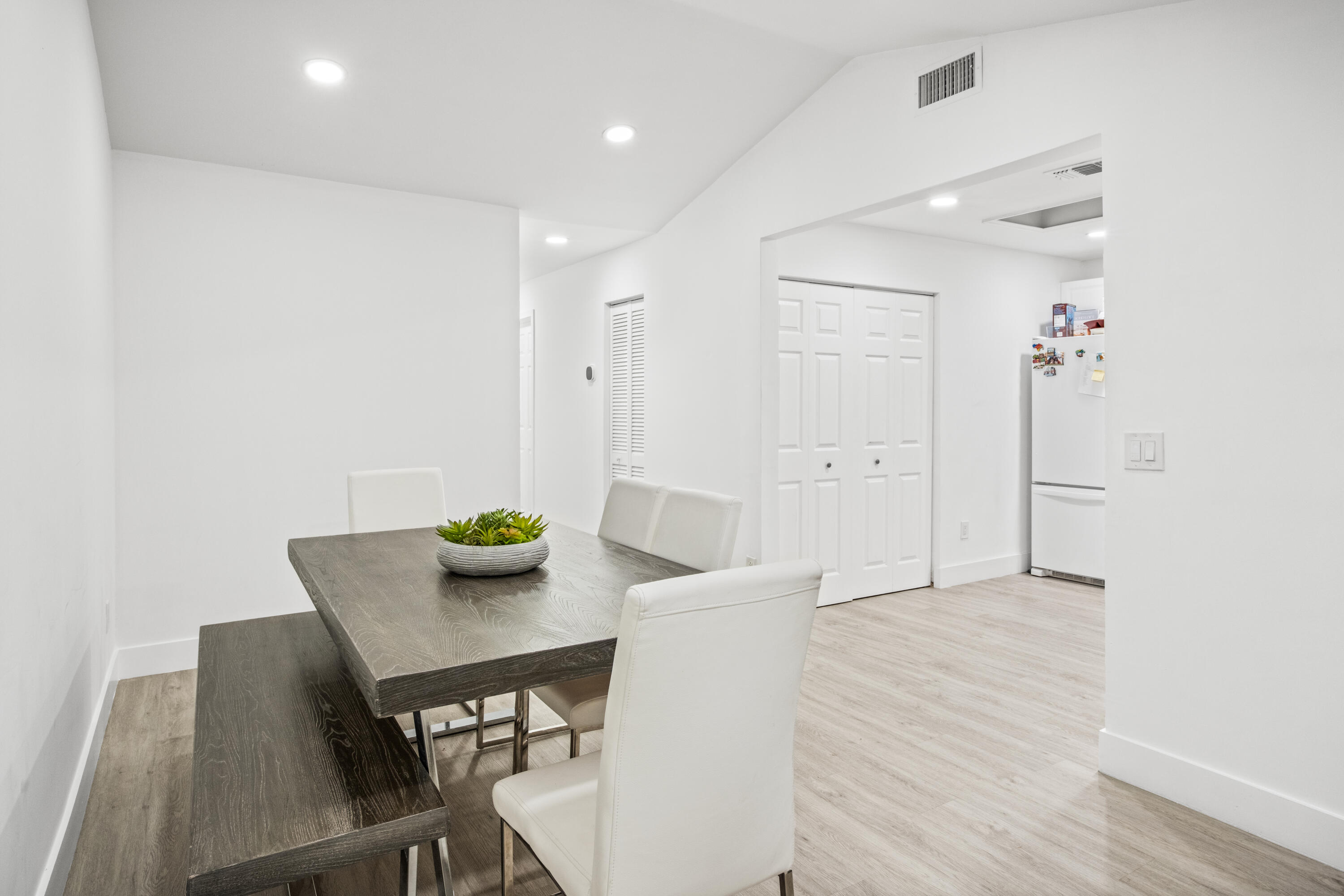 23284 Southwest 53rd Avenue, Unit D Boca Raton, FL 33433 - Photo 8 of 22 a view of a dining room with furniture and wooden floor