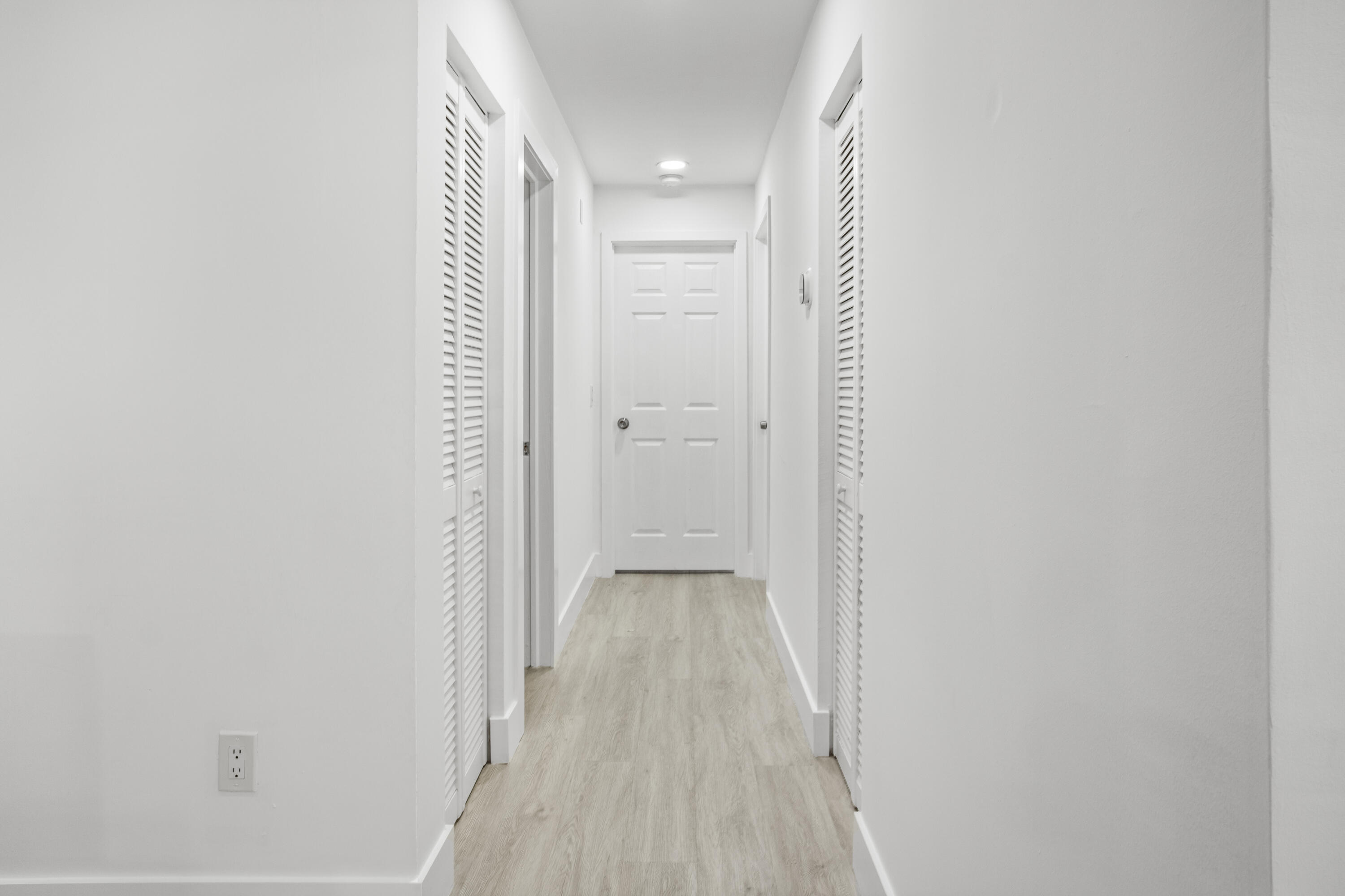 23284 Southwest 53rd Avenue, Unit D Boca Raton, FL 33433 - Photo 10 of 22 a view of a room with wooden floor and a bathroom