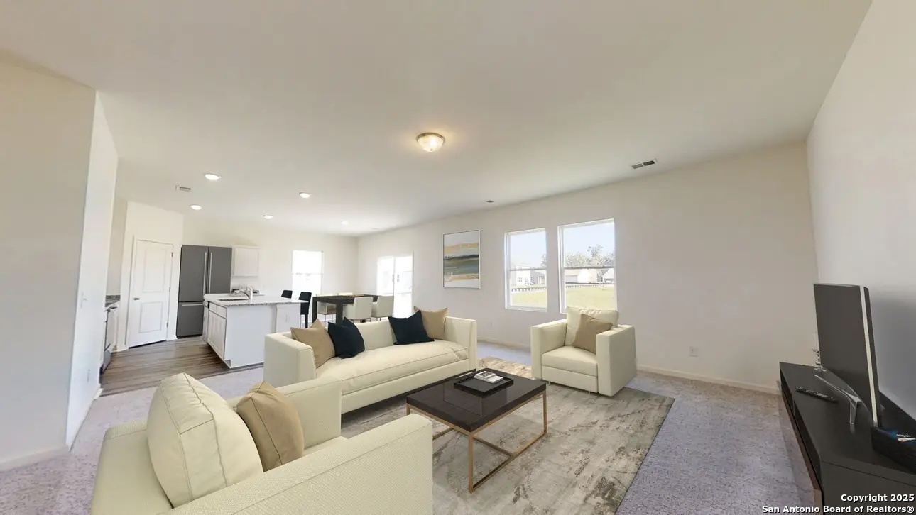 10514 Lesser Snow Adkins, TX 78101 - Photo 5 of 15 a living room with furniture and a flat screen tv
