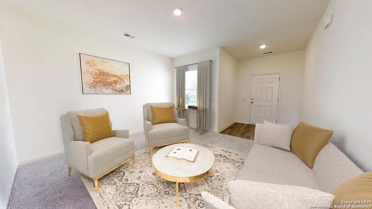 10514 Lesser Snow Adkins, TX 78101 - Photo 6 of 15 a living room with furniture and a rug