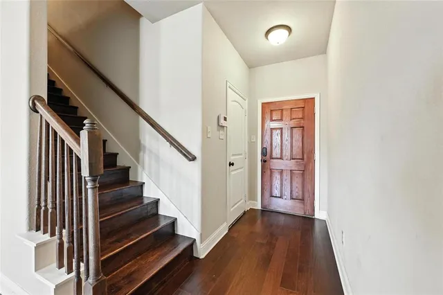 a view of an entryway with wooden floor
