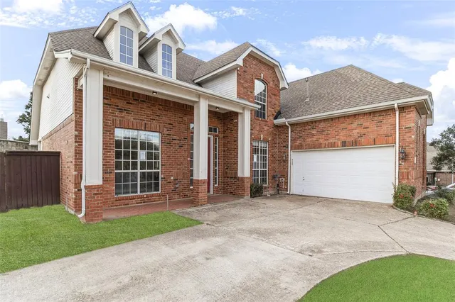 front view of a house with a small yard