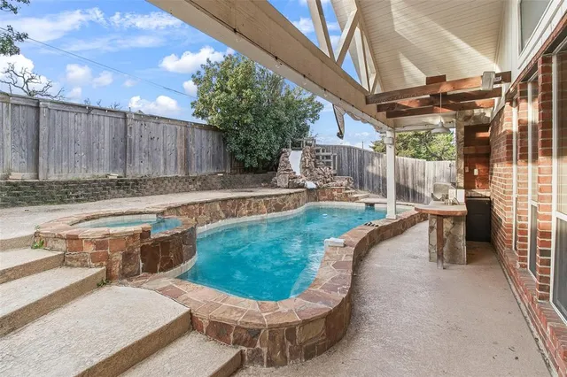 a view of a backyard with sitting area