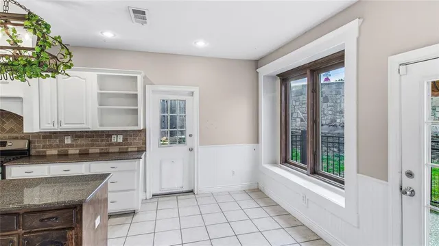 a kitchen with a sink a counter top space and appliances