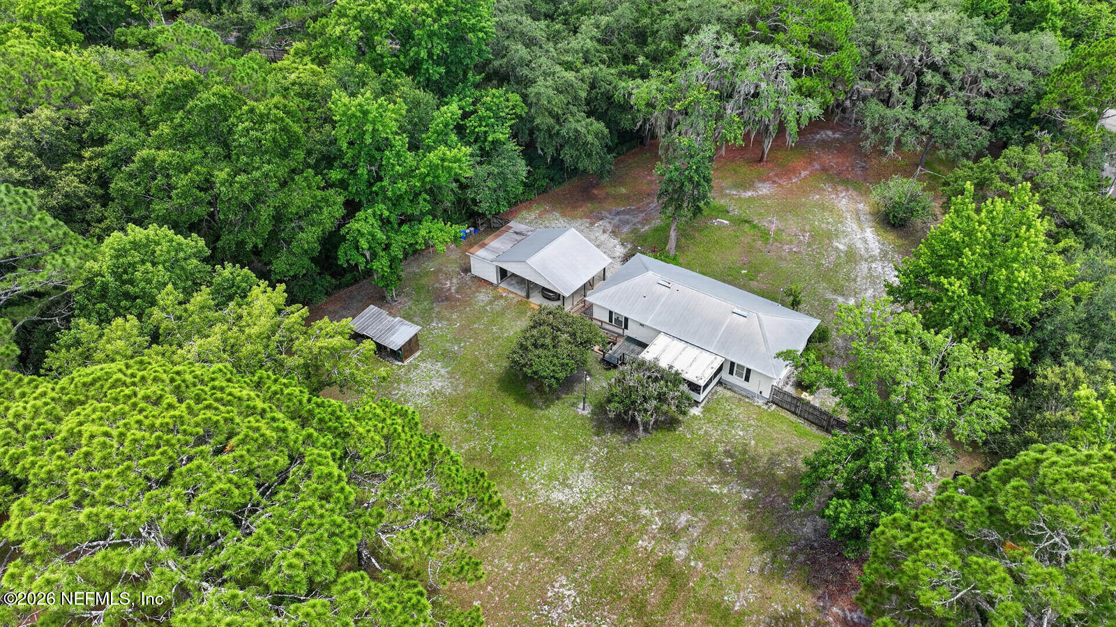1950 Lightsey Road St. Augustine, FL 32084 - Photo 49 of 57 an aerial view of residential house with outdoor space and trees all around