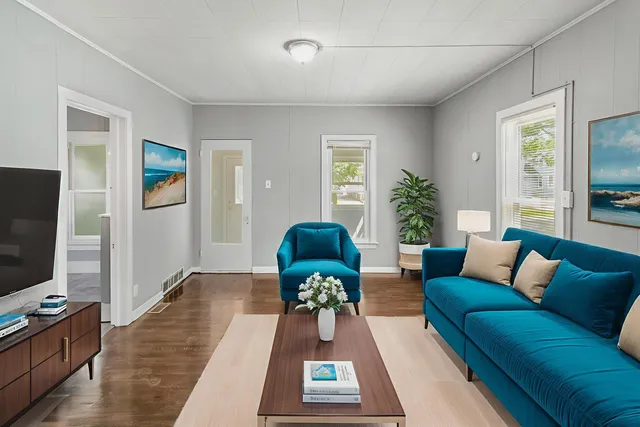 a living room with furniture and a flat screen tv