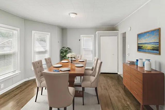 a view of a dining room with furniture window and wooden floor