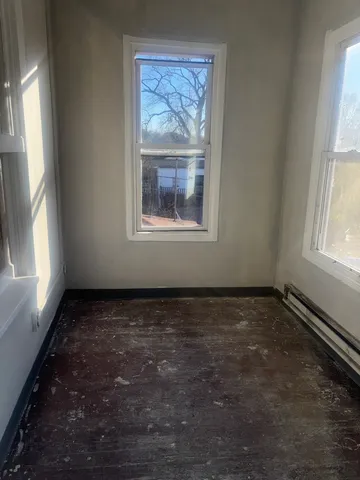 a view of an empty room with a window