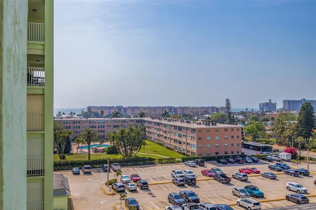 a kitchen with granite countertop white cabinets and a sink