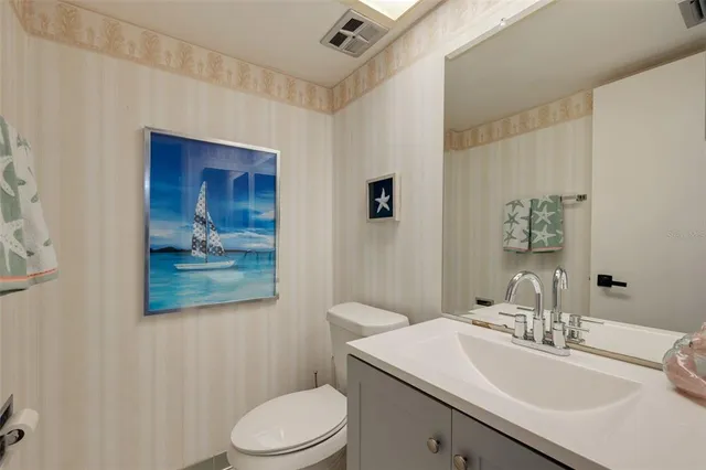 a bedroom with a bed and a tv