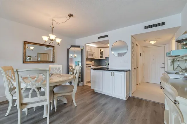 a swimming pool with outdoor seating and yard