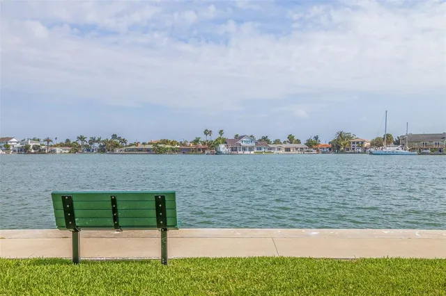 a kitchen with a stove and white cabinets
