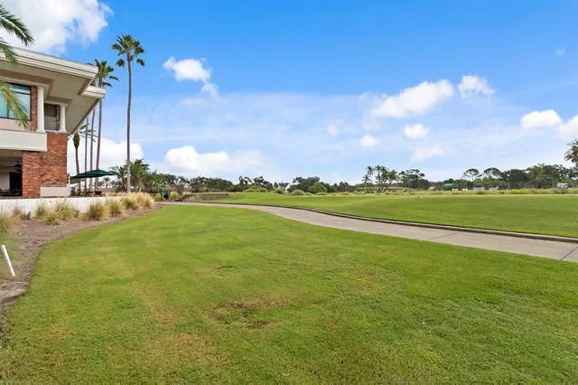 a view of a patio with a table and chairs