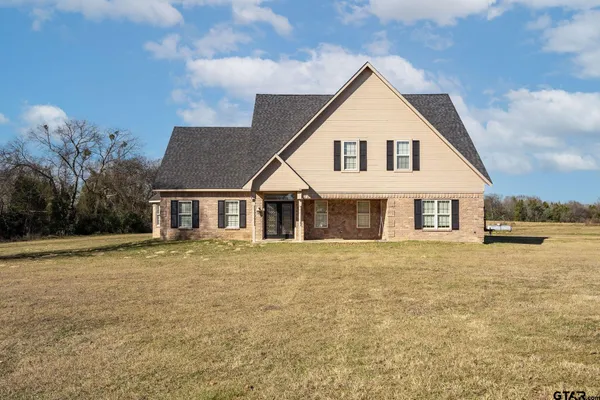 a view of house with outdoor space