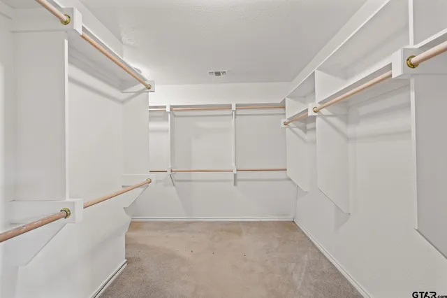 a view of an empty walk in closet