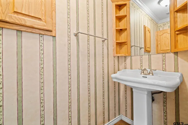 a bathroom with a sink and a mirror