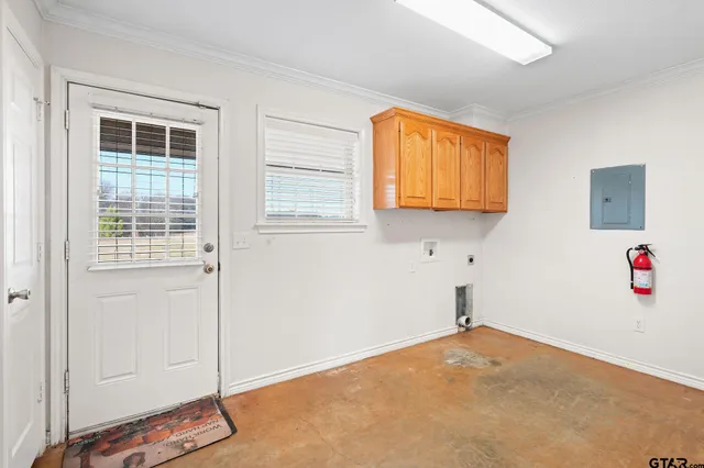 a view of a livingroom with an empty space and a window