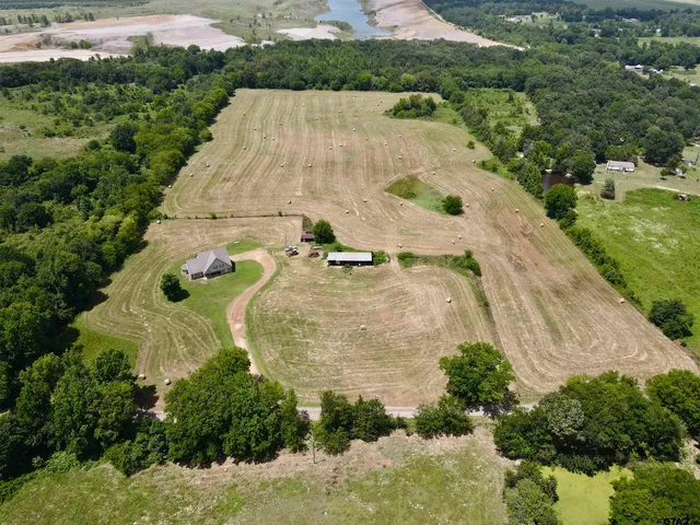 an aerial view of a house with outdoor space