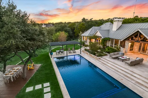a view of swimming pool with lounge chair