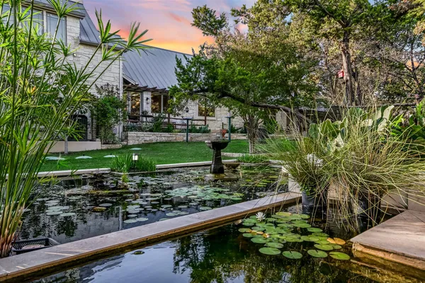 a balcony with lots of green space and plants