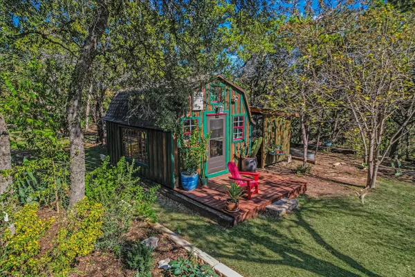 a view of a house with a yard and wooden floor