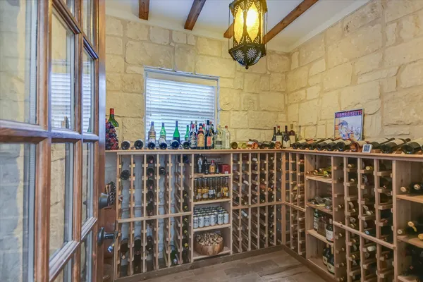 a living room with fireplace furniture and a wooden floor