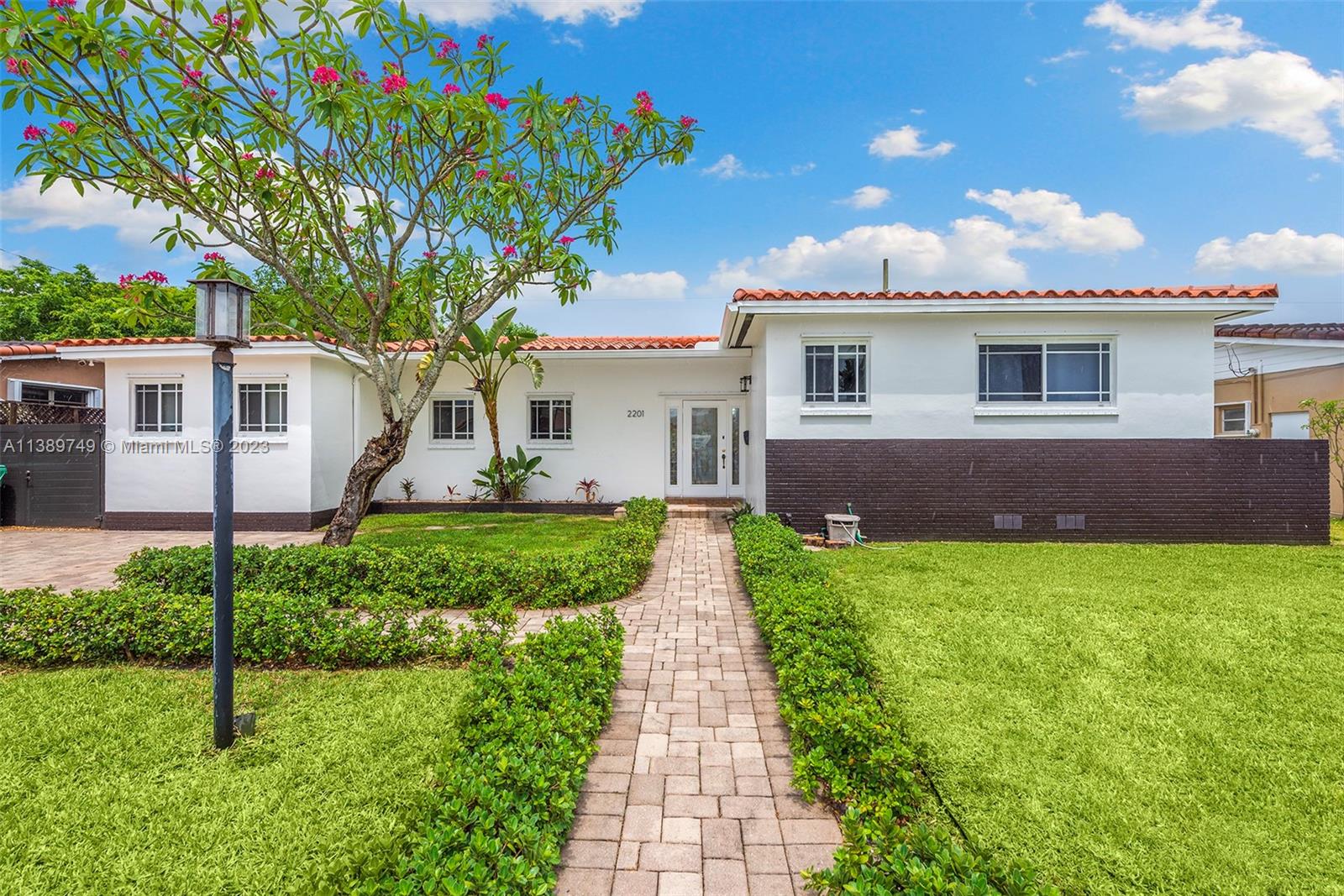 a front view of a house with garden