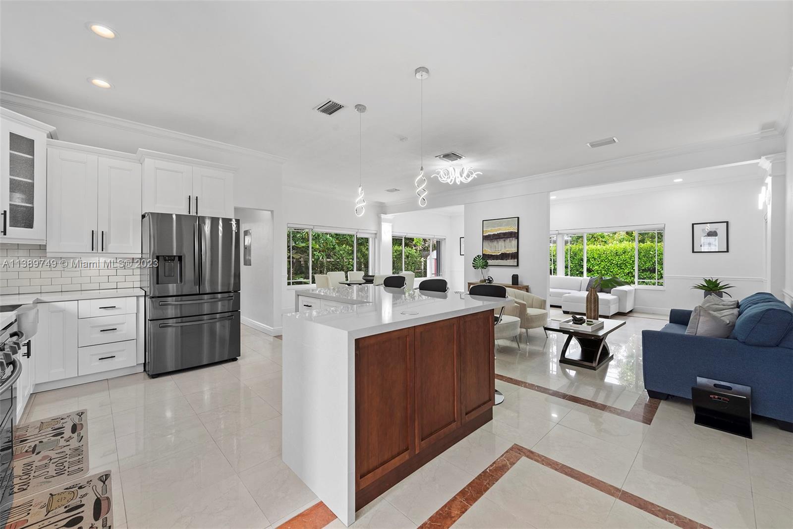 2201 Southwest 84th Avenue Miami, FL 33155 - Photo 17 of 33 a kitchen with stainless steel appliances granite countertop a refrigerator stove and sink