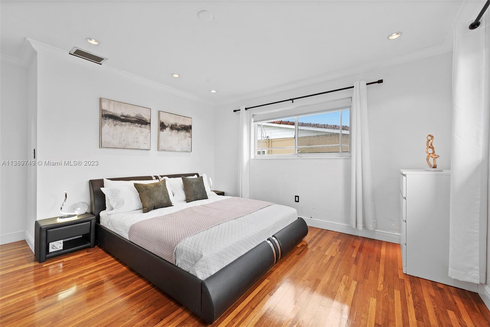 2201 Southwest 84th Avenue Miami, FL 33155 - Photo 18 of 33 a bedroom with a bed and wooden floor