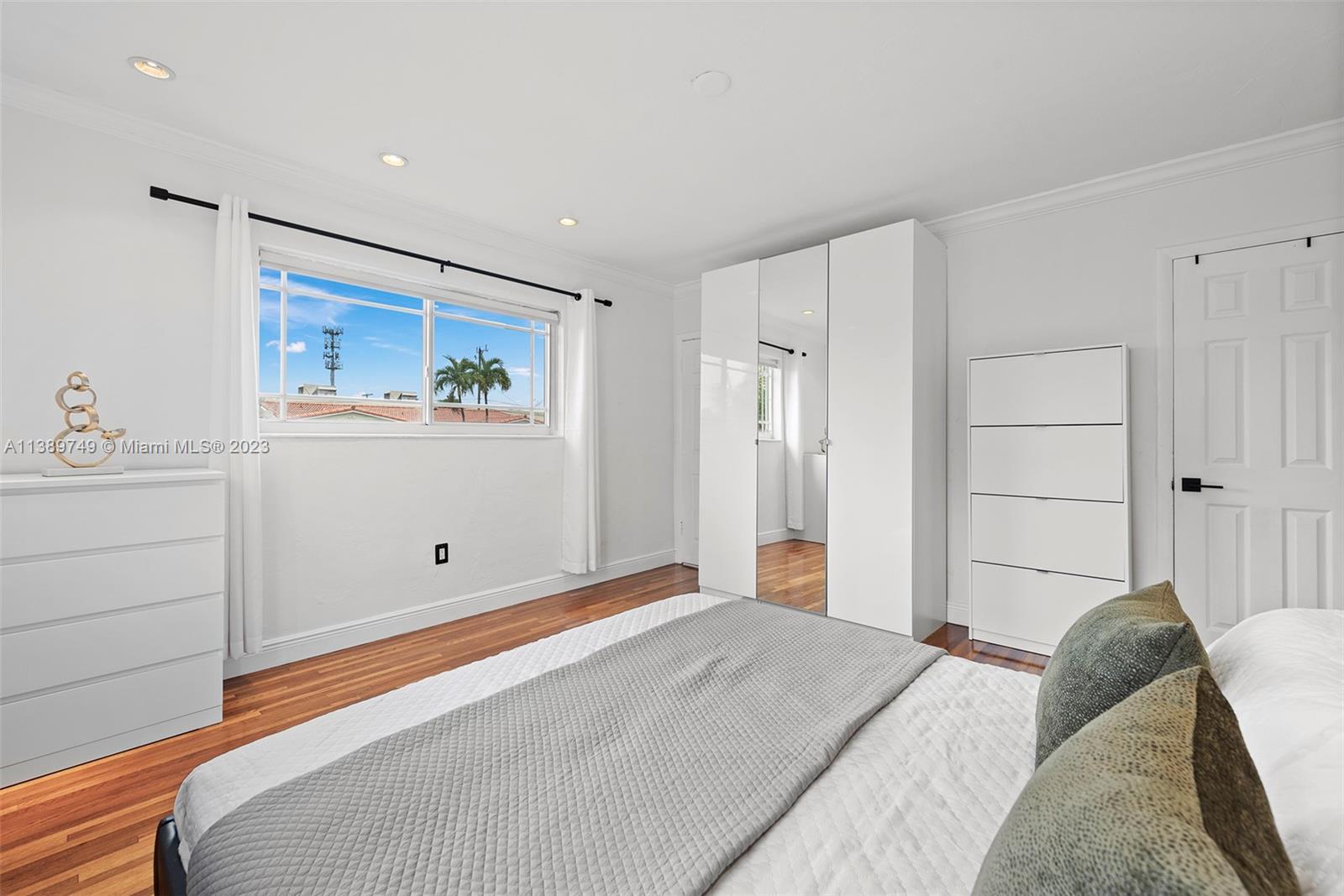 2201 Southwest 84th Avenue Miami, FL 33155 - Photo 19 of 33 a bedroom with a bed and a painting on the wall