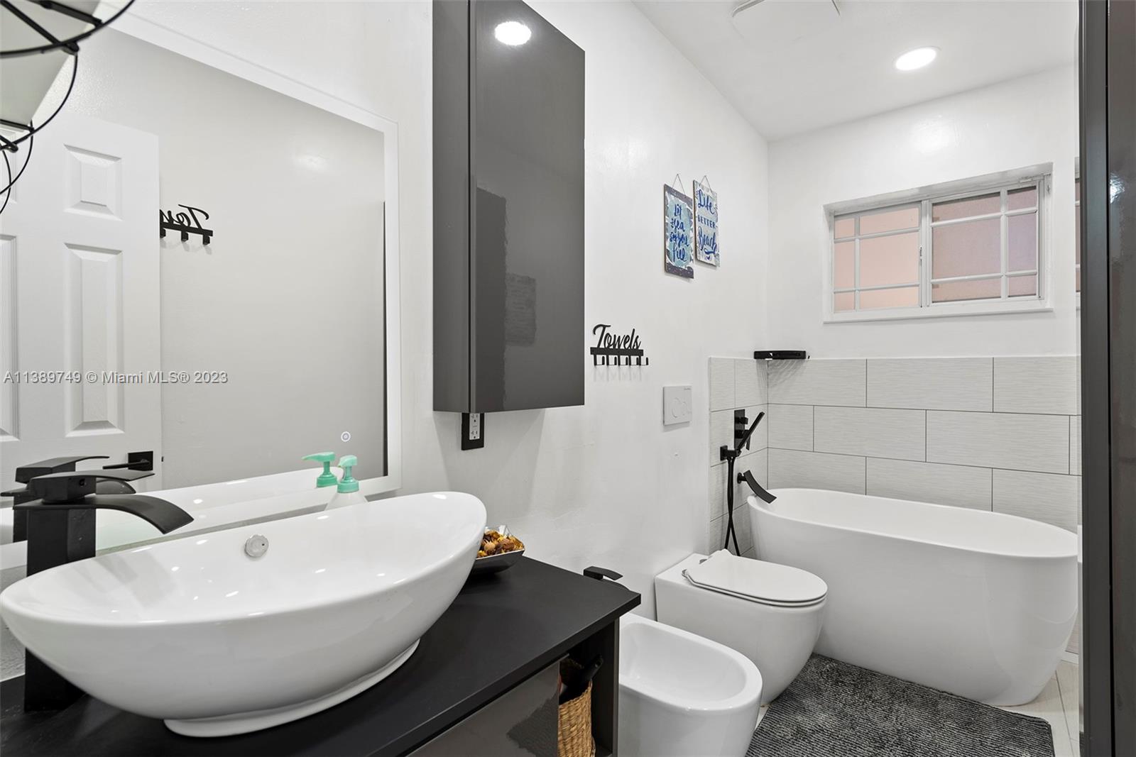 2201 Southwest 84th Avenue Miami, FL 33155 - Photo 20 of 33 a bathroom with a sink a toilet and bathtub