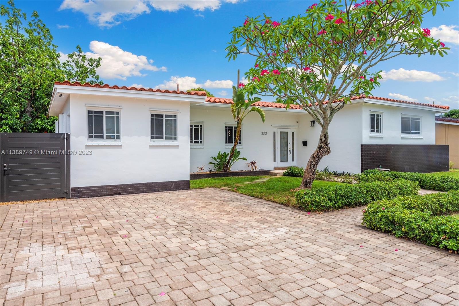 2201 Southwest 84th Avenue Miami, FL 33155 - Photo 2 of 33 a front view of a house with garden