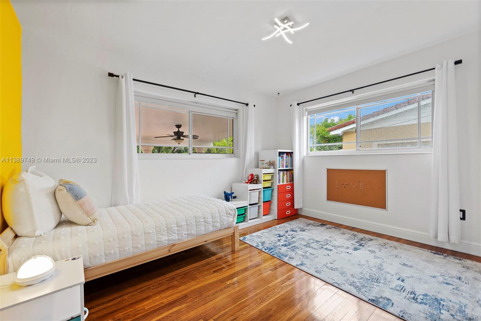 2201 Southwest 84th Avenue Miami, FL 33155 - Photo 22 of 33 a bedroom with a bed and a window