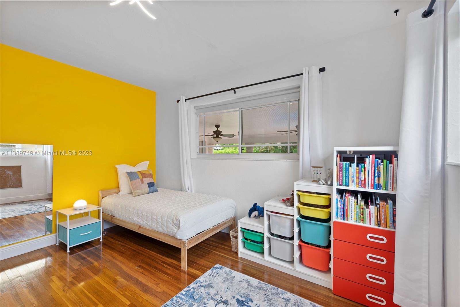 2201 Southwest 84th Avenue Miami, FL 33155 - Photo 23 of 33 a bedroom with a bed and a book shelf