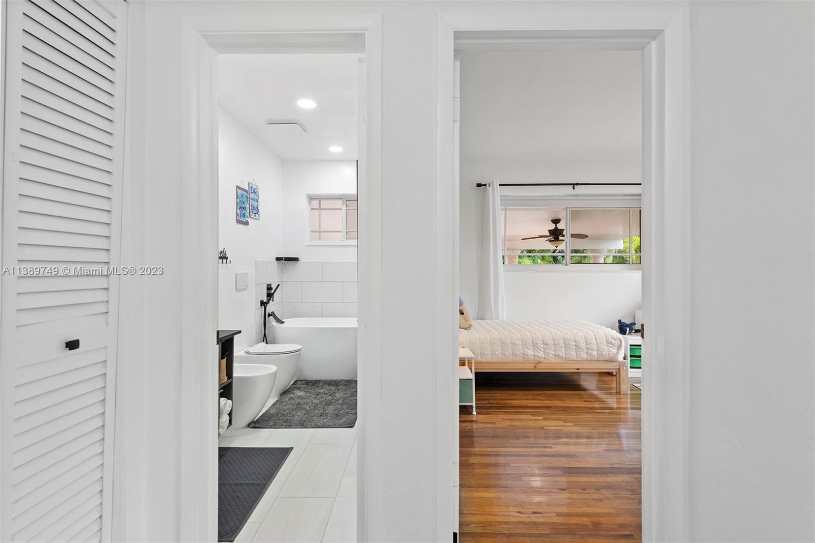 2201 Southwest 84th Avenue Miami, FL 33155 - Photo 24 of 33 a bathroom with a granite countertop sink a toilet and a shower