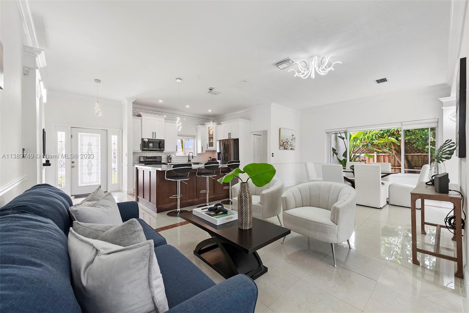 2201 Southwest 84th Avenue Miami, FL 33155 - Photo 3 of 33 a living room with furniture and kitchen view