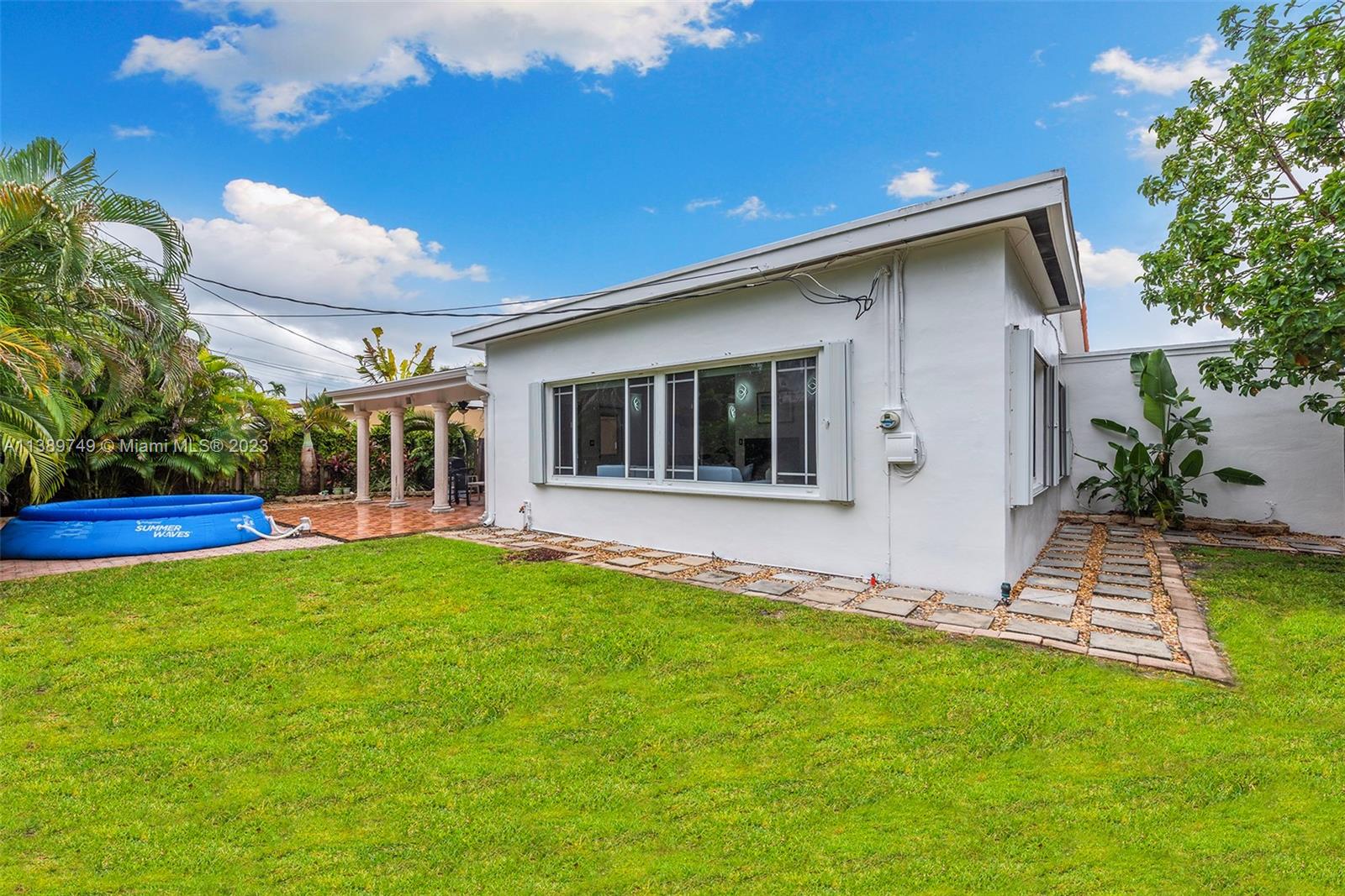 2201 Southwest 84th Avenue Miami, FL 33155 - Photo 32 of 33 a view of an house with backyard space and porch