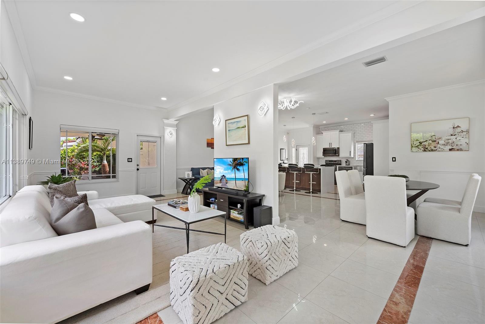 2201 Southwest 84th Avenue Miami, FL 33155 - Photo 4 of 33 a living room with furniture and a flat screen tv