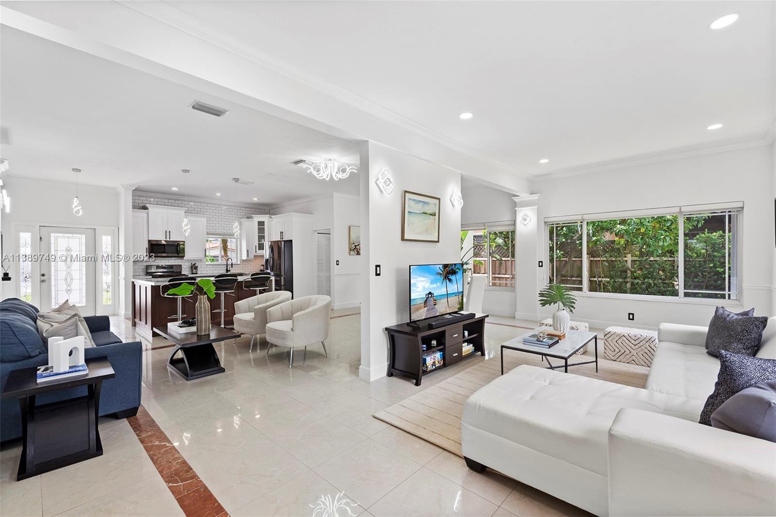 2201 Southwest 84th Avenue Miami, FL 33155 - Photo 5 of 33 a living room with furniture and a large window